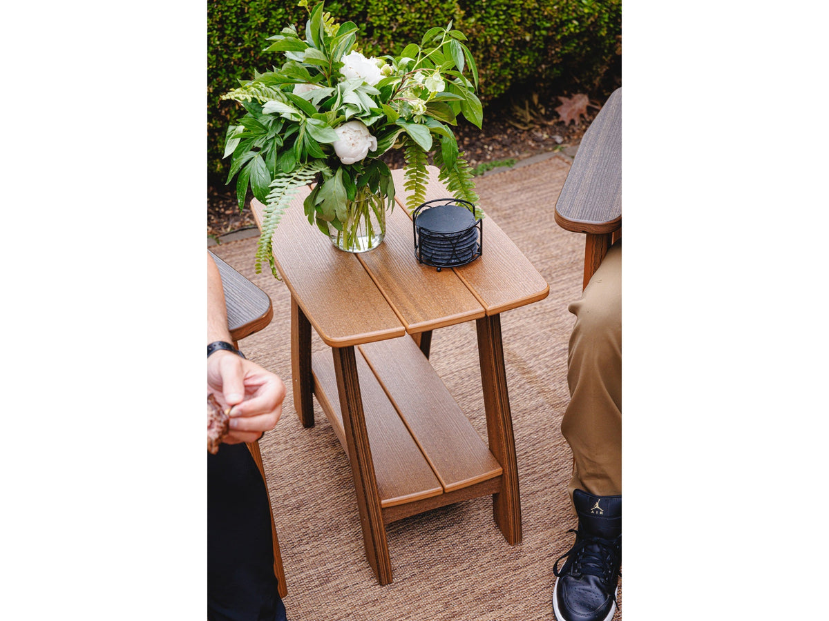 Brown Beaver Dam Majestic two-tier end table between two outdoor chairs